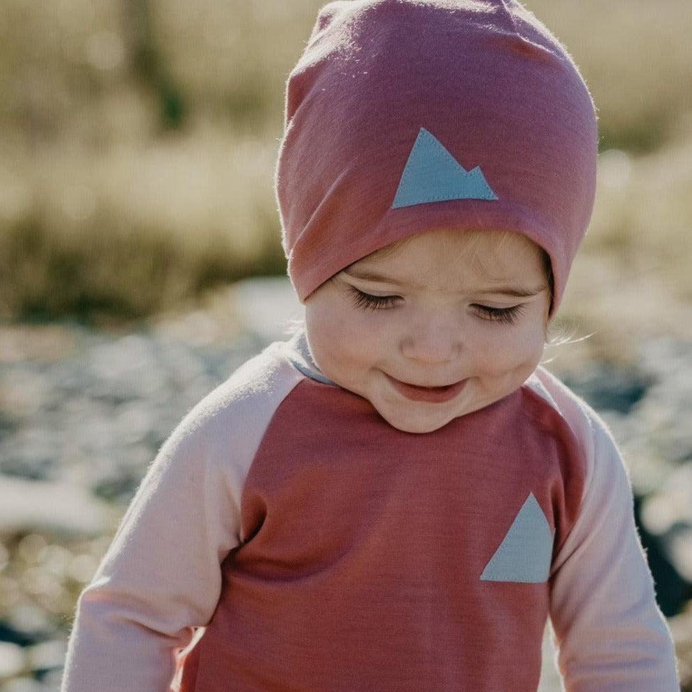 Baby in merino wool beanie hat and Crew Neck Top Base Layers Wildhaven Wools