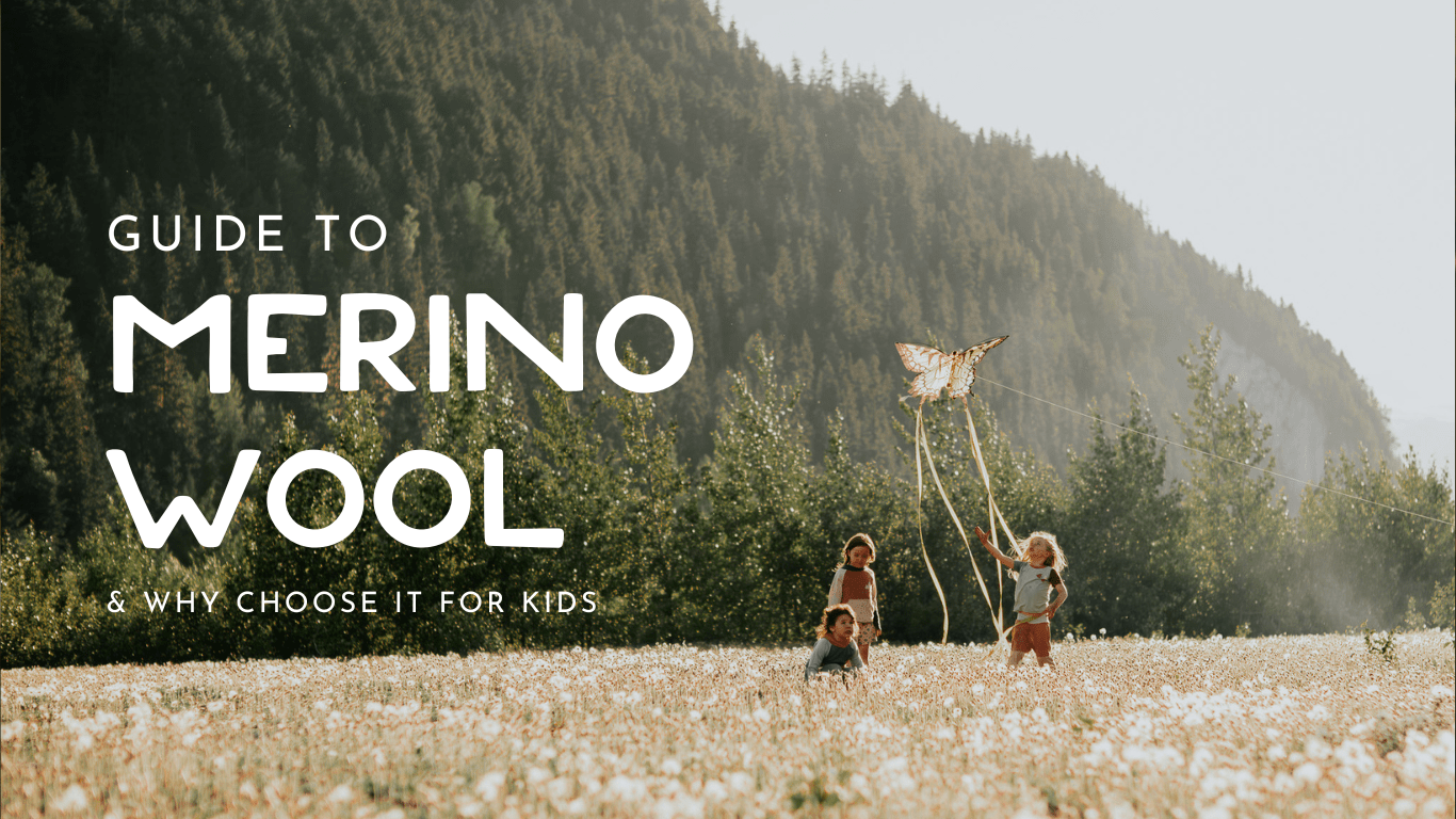 Children playing outdoors in a meadow, representing a guide to merino wool for kids