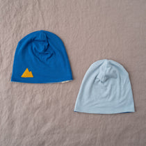 Reversible kids’ merino wool beanie in Alaska, shown from both sides.